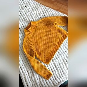 Divided mustard yellow mock neck crop sweater